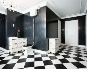 A black and white checkered floor tile in a bathroom remodel.