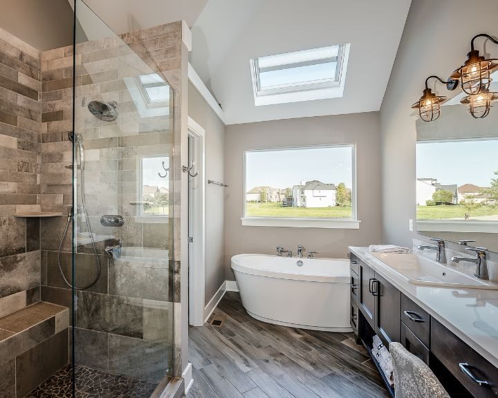 An expansive bathroom featuring a walk in shower and tub.