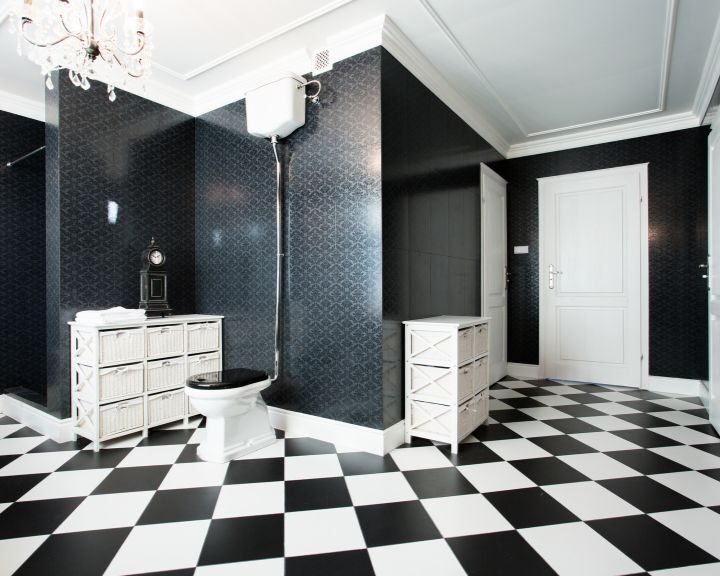 A black and white checkered tiled floor in a bathroom in Waterbury.