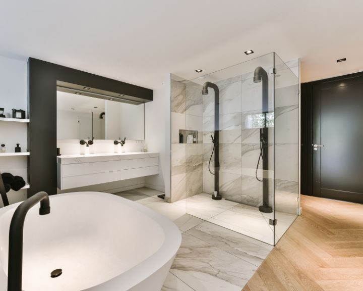 A modern bathroom with a glass shower.