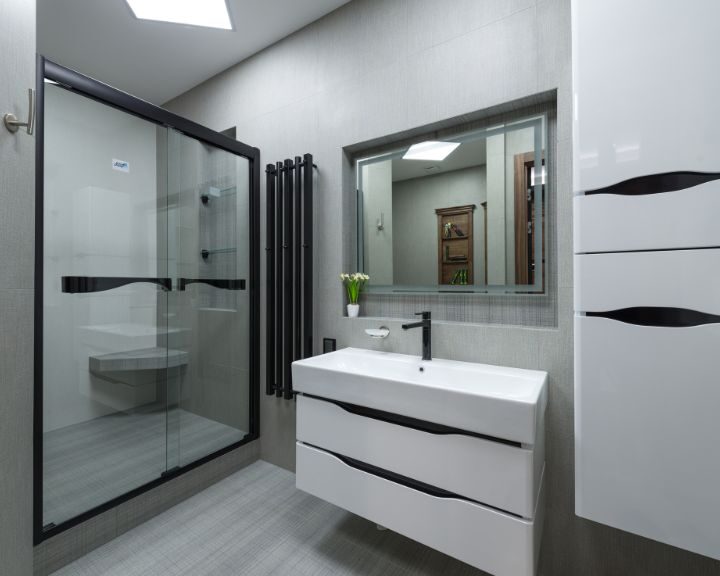 A modern bathroom with a glass shower.